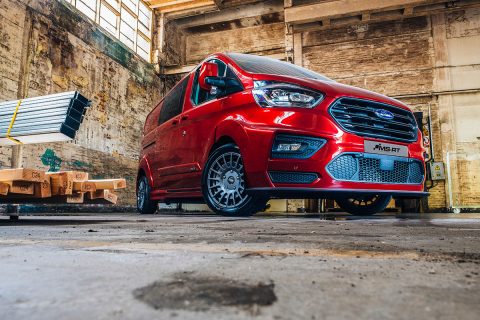 Red Ford Custom MS-RT staged in a warehouse