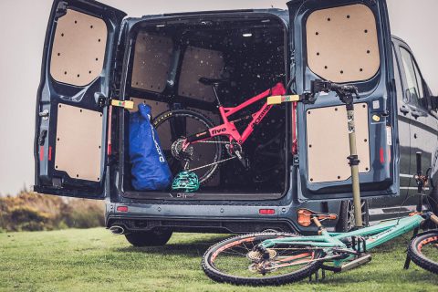 Ford transit MSRT van with boot open and mountain bikes inside