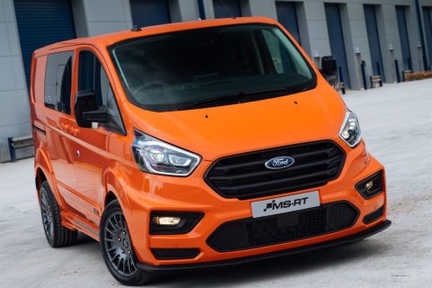 orange transit custom msrt for sale staged in a city