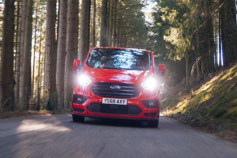 red custom msrt driving in the woods