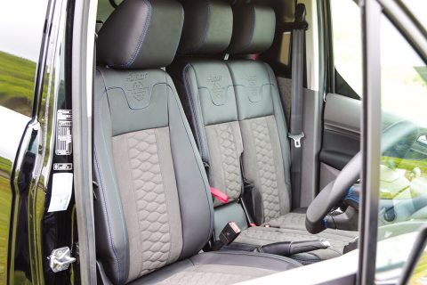 The interior of a Transit Connect. There are three bespoke leather and suede MSRT seats.