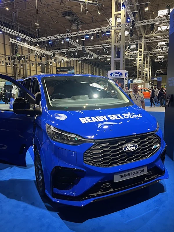 Front view of the blue Ford Transit Custom with Ready Set Ford branding at CV Show 2026