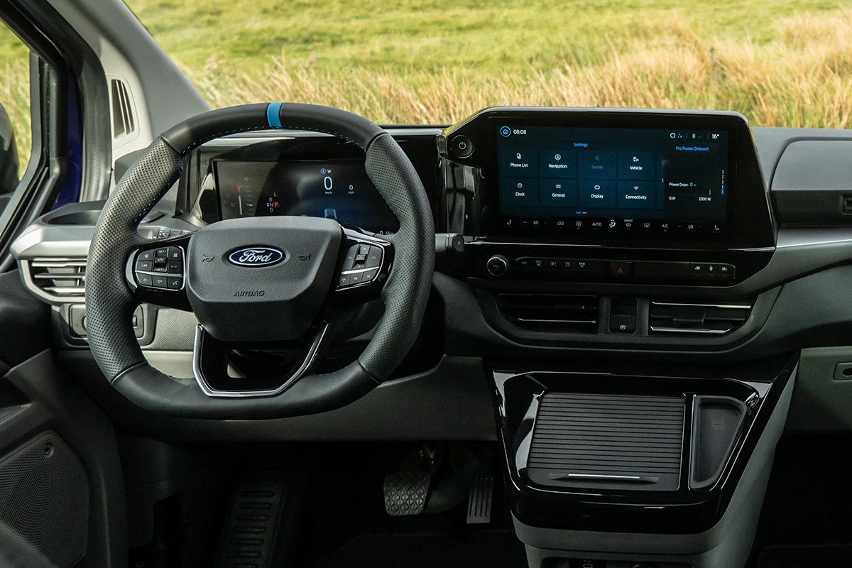 Eco-leather and suede sports interior with illuminated MS-RT branding and blue contrast stitching. 