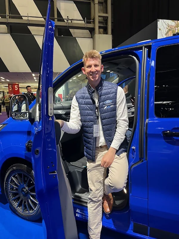 Shane next to the Ford Transit Custom at Commercial Vehicle Show 2026